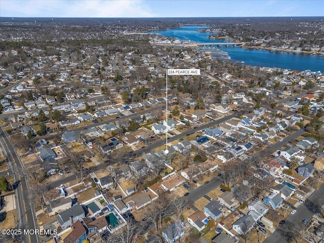 bird's eye view featuring a water view and a residential view