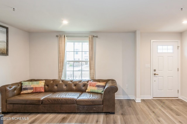 living area with recessed lighting, wood finished floors, and baseboards