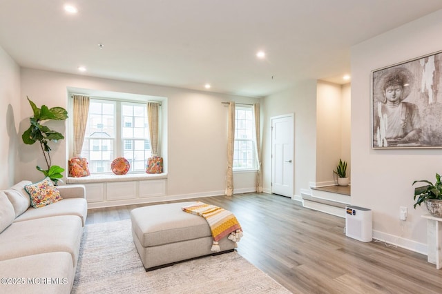 living room with recessed lighting, wood finished floors, and baseboards