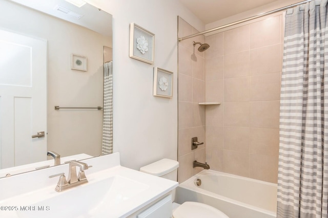 full bathroom featuring visible vents, vanity, toilet, and shower / tub combo