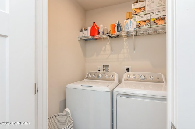 laundry room with washer and dryer and laundry area