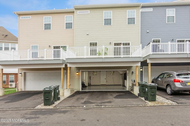 rear view of house with an attached garage