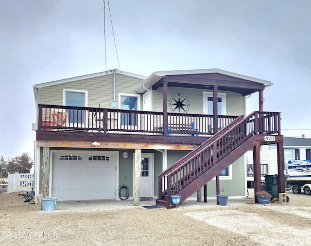 view of front of home featuring a garage and stairs