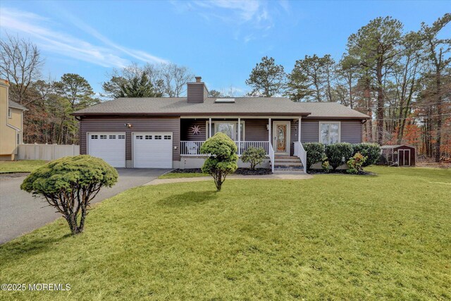 1500 First Ave, Toms River, NJ 08757 - ranch-style house with a front yard, covered porch, a chimney, a garage, and driveway