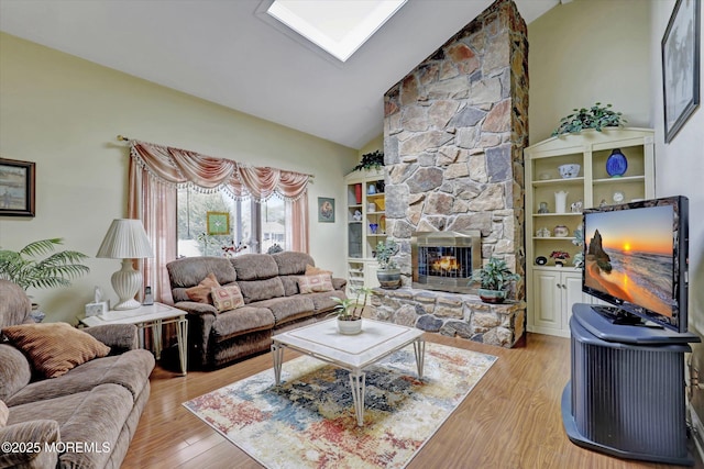1500 First Ave, Toms River, NJ 08757 - living area featuring a fireplace, light wood-style floors, and high vaulted ceiling