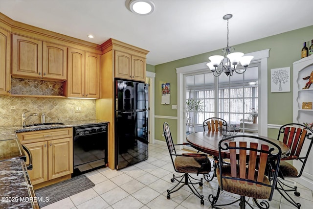 1500 First Ave, Toms River, NJ 08757 - kitchen with stone counters, a sink, black appliances, a notable chandelier, and tasteful backsplash