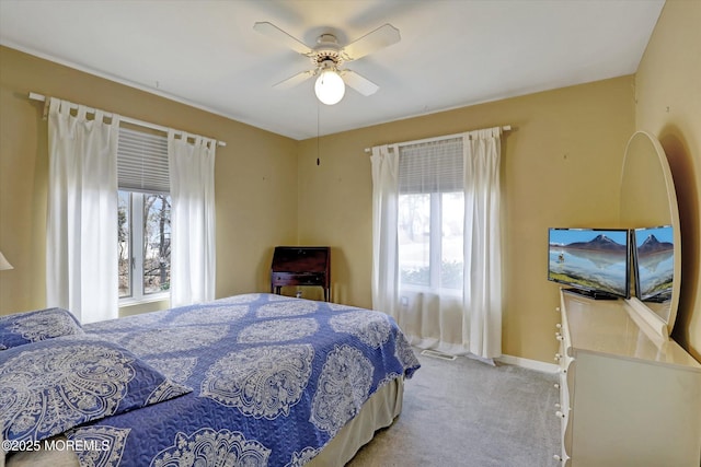 1500 First Ave, Toms River, NJ 08757 - bedroom featuring multiple windows, a ceiling fan, baseboards, and light carpet