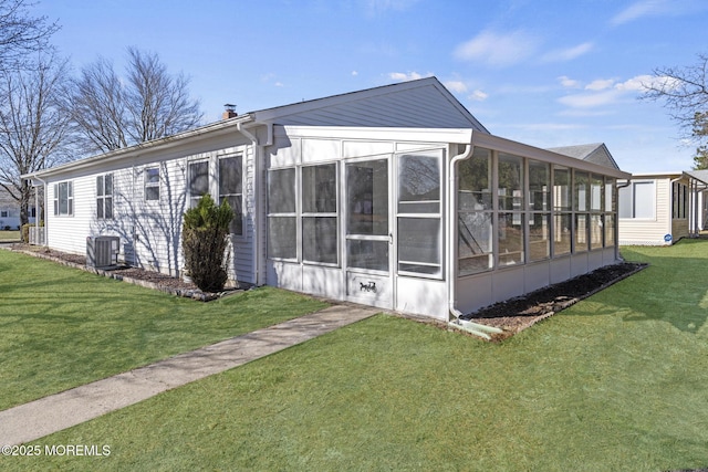 1 Redlands Ct, Toms River, NJ 08757 - view of side of home with central AC unit, a lawn, and a sunroom