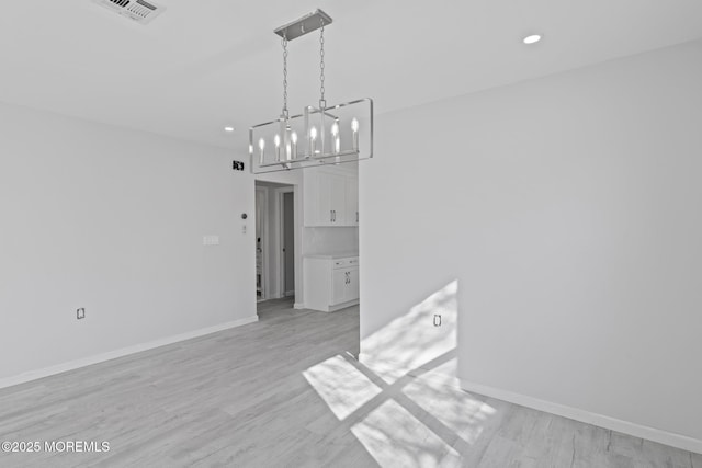 1 Redlands Ct, Toms River, NJ 08757 - unfurnished dining area featuring an inviting chandelier, recessed lighting, baseboards, and light wood-type flooring