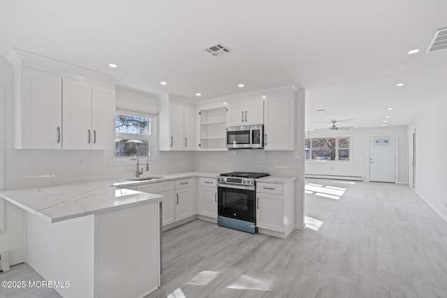 1 Redlands Ct, Toms River, NJ 08757 - kitchen with visible vents, a sink, stainless steel appliances, white cabinets, and a baseboard radiator