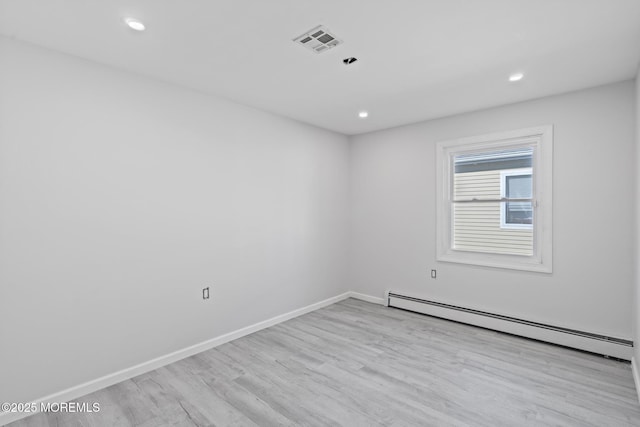 1 Redlands Ct, Toms River, NJ 08757 - spare room with visible vents, baseboards, baseboard heating, and wood finished floors