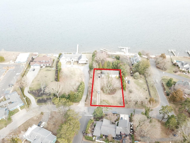 16 Ensor Pl, Island Heights, NJ 08732 - aerial view of property and surrounding area featuring property parcel outlined, nearby suburban area, and a large body of water