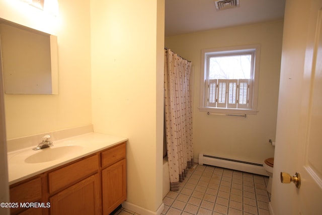16 Ensor Pl, Island Heights, NJ 08732 - bathroom featuring a baseboard heating unit, tile patterned floors, toilet, and vanity