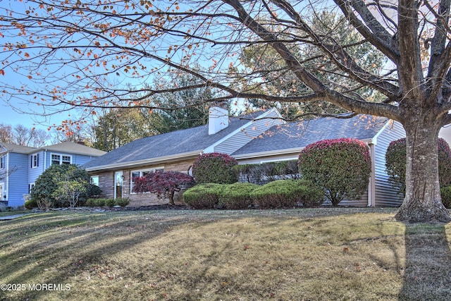 415 Parkview Ave, Ocean Twp, NJ 07712 - view of front of property featuring a front yard, a shingled roof, and a chimney