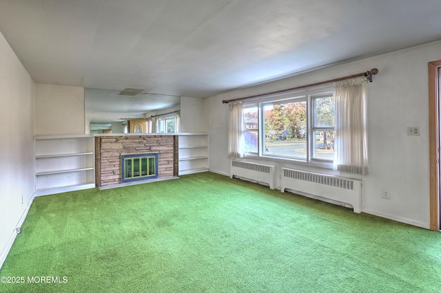 415 Parkview Ave, Ocean Twp, NJ 07712 - unfurnished living room with carpet flooring, a stone fireplace, baseboards, and radiator