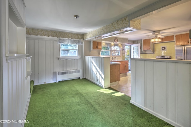 415 Parkview Ave, Ocean Twp, NJ 07712 - kitchen featuring stainless steel fridge with ice dispenser, radiator heating unit, light carpet, light countertops, and brown cabinets