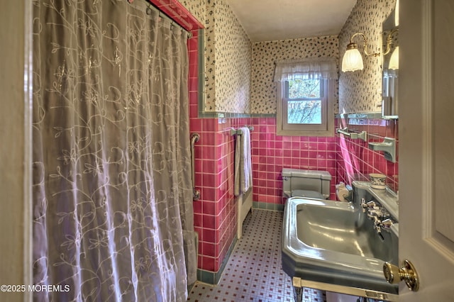 415 Parkview Ave, Ocean Twp, NJ 07712 - bathroom with wallpapered walls, a sink, wainscoting, and tile walls