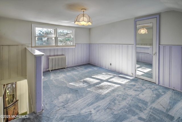 415 Parkview Ave, Ocean Twp, NJ 07712 - carpeted empty room with radiator heating unit, wainscoting, and vaulted ceiling