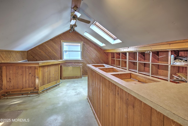 415 Parkview Ave, Ocean Twp, NJ 07712 - additional living space with wood walls, carpet, a ceiling fan, and lofted ceiling with skylight