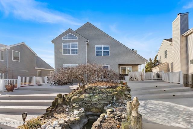 rear view of property featuring a patio