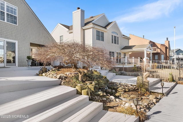 exterior space with fence and a residential view