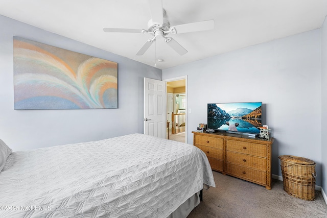 carpeted bedroom with a ceiling fan
