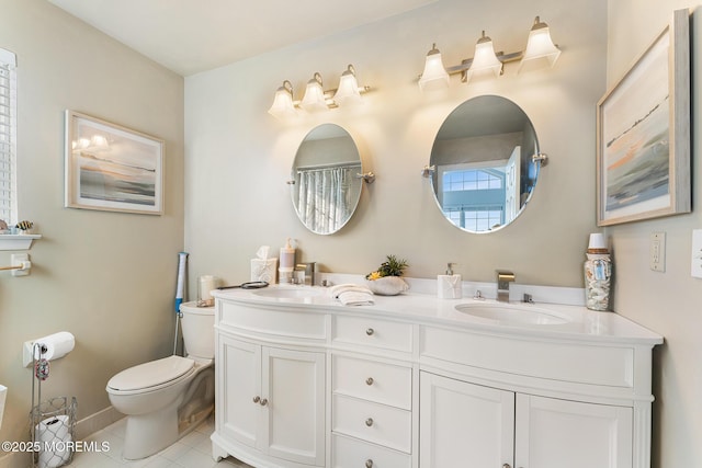 bathroom with toilet, tile patterned flooring, a sink, and double vanity