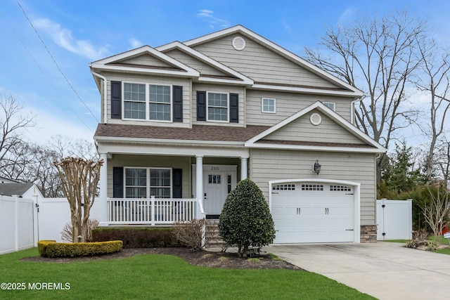 view of front facade featuring a gate, a porch, driveway, and fence