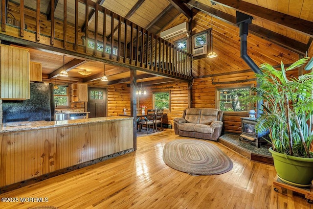 461 Harmony Rd, Jackson, NJ 08527 - kitchen with a wood stove, light wood-type flooring, freestanding refrigerator, high vaulted ceiling, and dishwasher