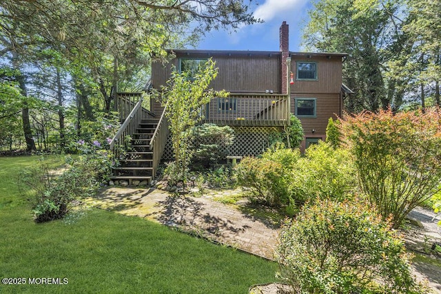 461 Harmony Rd, Jackson, NJ 08527 - back of property with stairway, a chimney, a deck, and a yard
