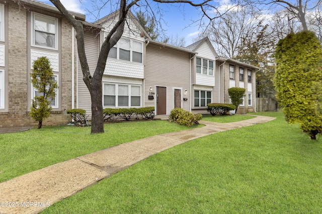 view of property with a front lawn
