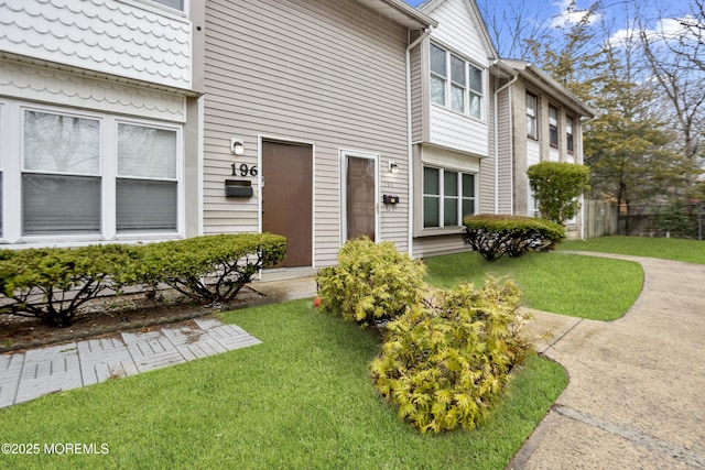 entrance to property with a yard