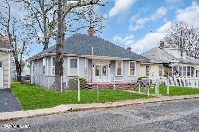 9 Maplewood Ave, Keansburg, NJ 07734 - bungalow-style home featuring a front yard, a fenced front yard, and a chimney