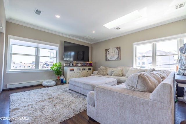 living area featuring a wealth of natural light, crown molding, and visible vents
