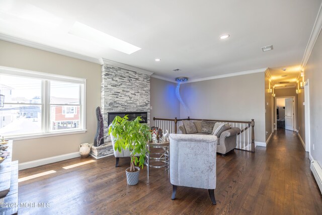 living room with visible vents, crown molding, baseboards, a fireplace, and dark wood-style flooring