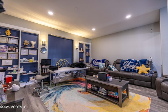 living area featuring wood finished floors and recessed lighting