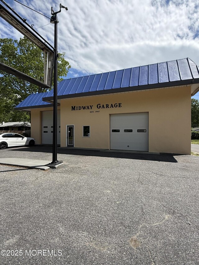 185 W Commodore Blvd, Jackson, NJ 08527 - view of building exterior featuring a garage