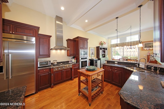 26 Aspen Ln, Tinton Falls, NJ 07724 - kitchen with a sink, built in appliances, dark brown cabinets, and wall chimney range hood