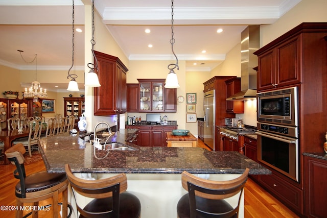 26 Aspen Ln, Tinton Falls, NJ 07724 - kitchen with dark brown cabinets, wall chimney exhaust hood, built in appliances, and a sink
