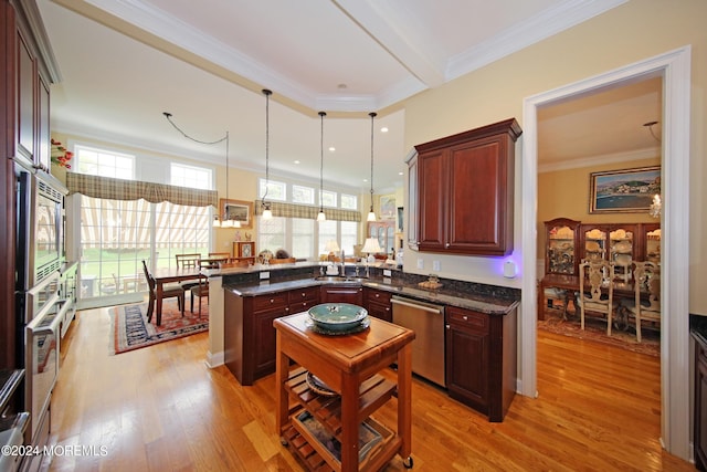 26 Aspen Ln, Tinton Falls, NJ 07724 - kitchen with a peninsula, light wood-style flooring, crown molding, and appliances with stainless steel finishes