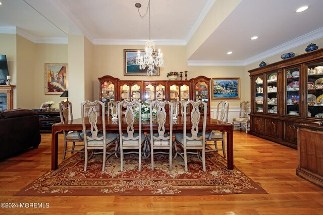 26 Aspen Ln, Tinton Falls, NJ 07724 - dining space featuring an inviting chandelier, wood finished floors, crown molding, and recessed lighting