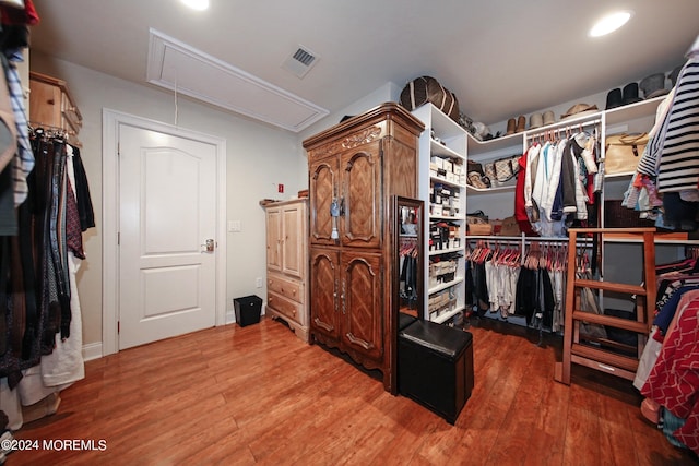 26 Aspen Ln, Tinton Falls, NJ 07724 - walk in closet featuring visible vents, attic access, and wood finished floors