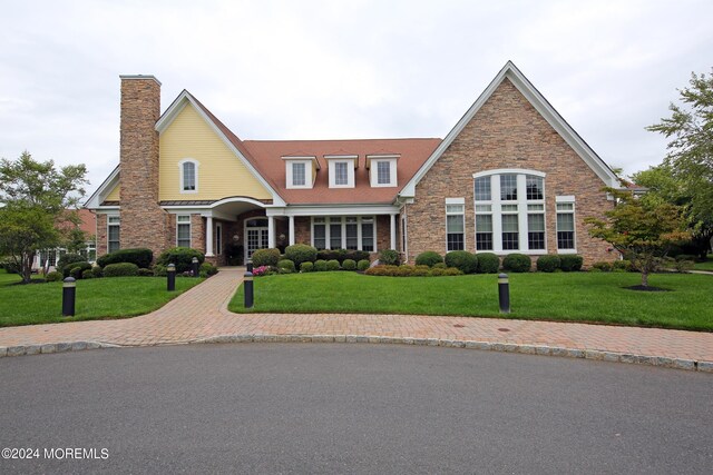 26 Aspen Ln, Tinton Falls, NJ 07724 - view of front of property with a chimney and a front lawn