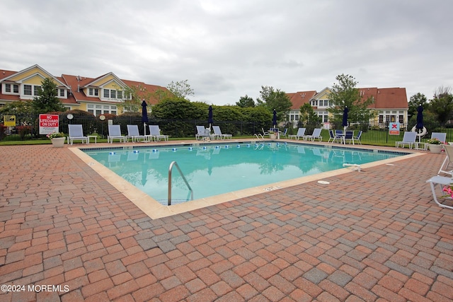 26 Aspen Ln, Tinton Falls, NJ 07724 - pool with a patio and fence
