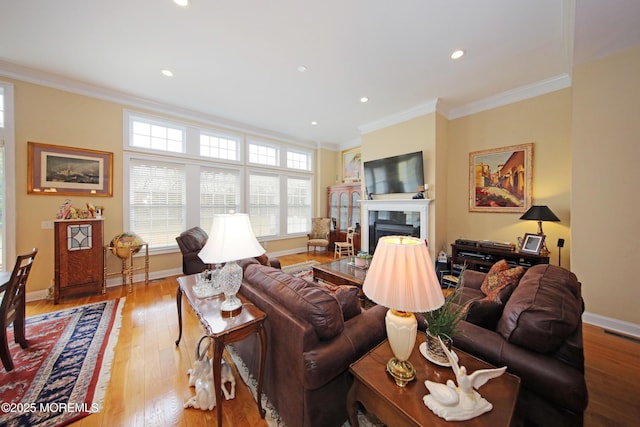 26 Aspen Ln, Tinton Falls, NJ 07724 - living room with baseboards, a fireplace, crown molding, and hardwood / wood-style flooring