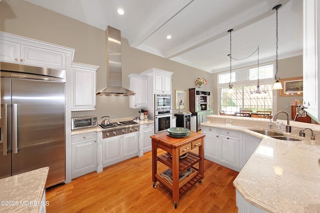 26 Aspen Ln, Tinton Falls, NJ 07724 - kitchen with light wood-style flooring, a sink, white cabinets, built in appliances, and wall chimney range hood