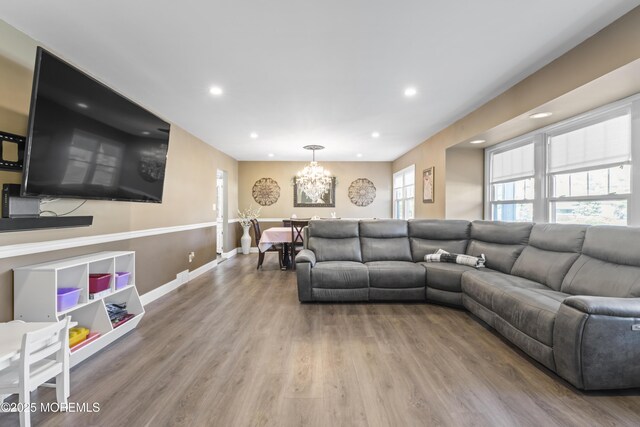 4 Whitman Rd, Morganville, NJ 07751 - living area featuring recessed lighting, wood finished floors, baseboards, and a chandelier