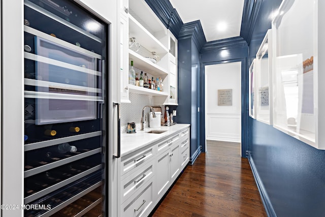 20 Conover Ln, Rumson, NJ 07760 - bar featuring indoor wet bar, a sink, dark wood-style flooring, wine cooler, and baseboards