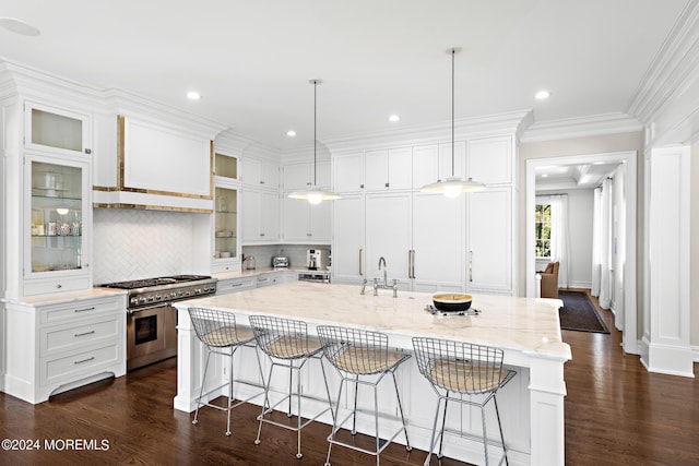 20 Conover Ln, Rumson, NJ 07760 - kitchen with dark wood-style floors, white cabinets, a large island, and double oven range