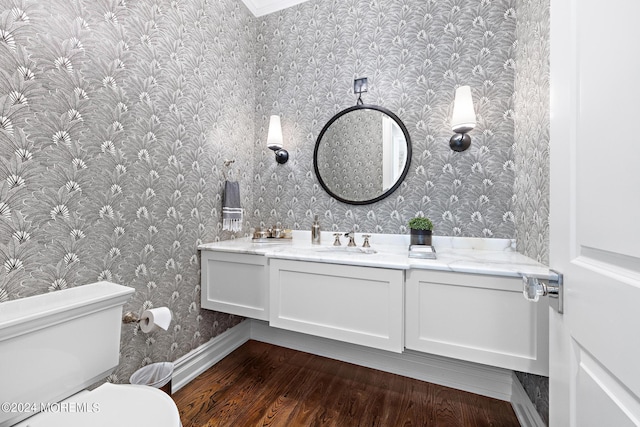 20 Conover Ln, Rumson, NJ 07760 - half bathroom with wallpapered walls, baseboards, toilet, wood finished floors, and vanity